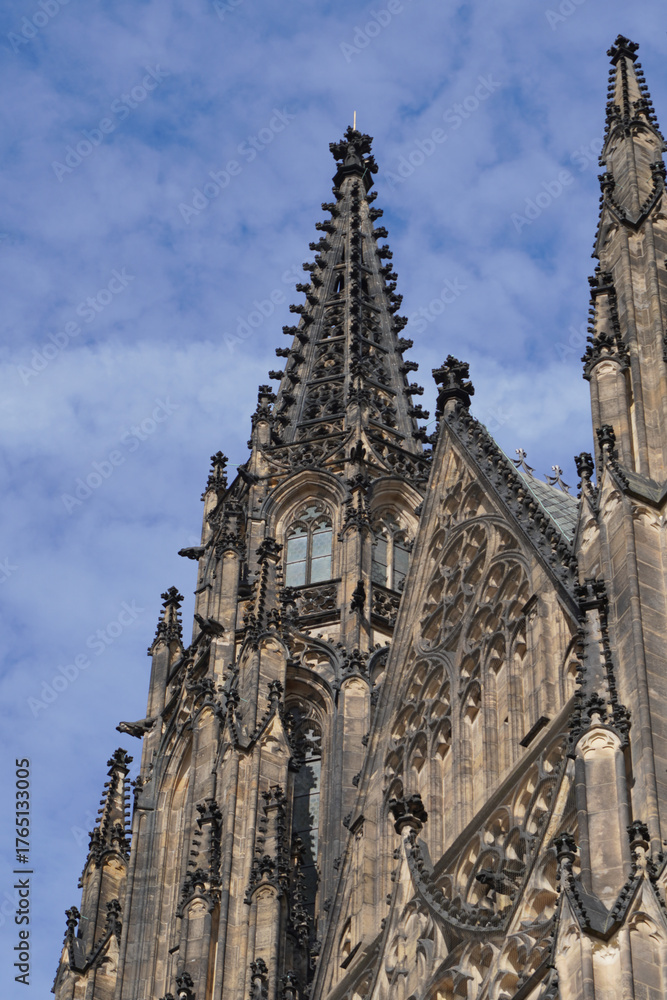 Fototapeta premium Beautiful aerial and detailed view of St. Vitus Cathedral in Prague Castle, Czech Republic, showcasing Gothic architecture, gargoyles, stained glass, and the historic city skyline.