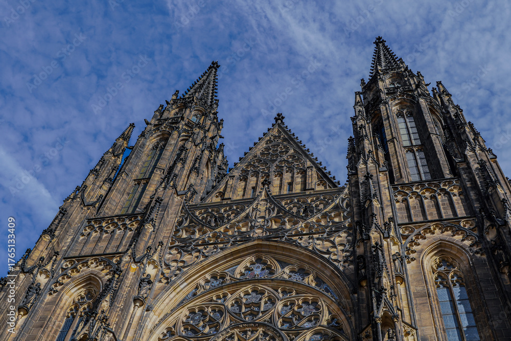 Fototapeta premium Beautiful aerial and detailed view of St. Vitus Cathedral in Prague Castle, Czech Republic, showcasing Gothic architecture, gargoyles, stained glass, and the historic city skyline.