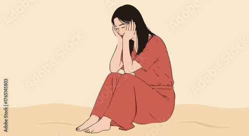 A young woman sits with her head in her hands, appearing distressed or sad.