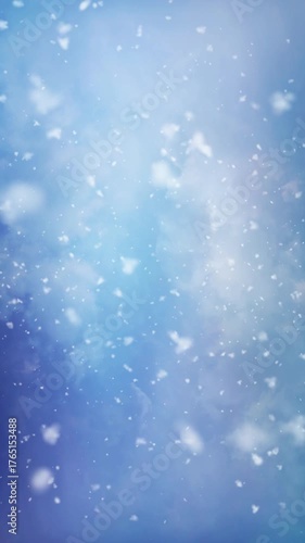 Vertical Snowflakes Big and Fluffy Falling Blue Sky 4K Loop features rolling clouds in a blue sky and big fluffy snowflakes falling toward the viewer in a vertical ratio loop.