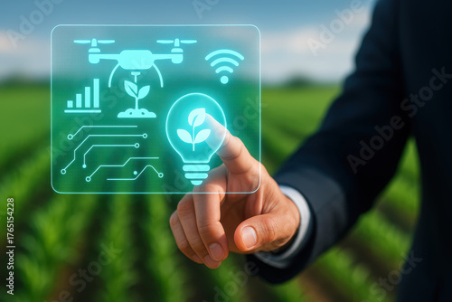Futuristic technology in agriculture is showcased with hand interacting with digital interface featuring drone, plant growth, and connectivity symbols, symbolizing innovation and sustainability