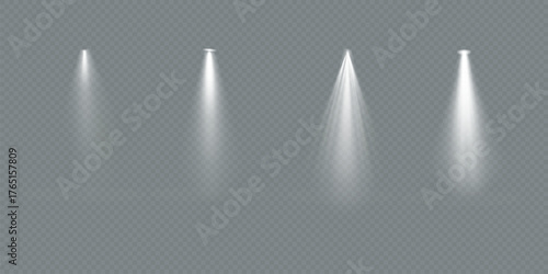 Four bright spotlights shine on a dark stage. Spotlights create dramatic lighting. Each spotlight casts a focused beam. Spotlights illuminate the stage.