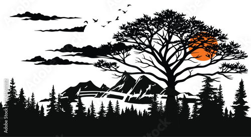Silhouette of a large deciduous tree against a dramatic sunset with mountains and a forest in the foreground