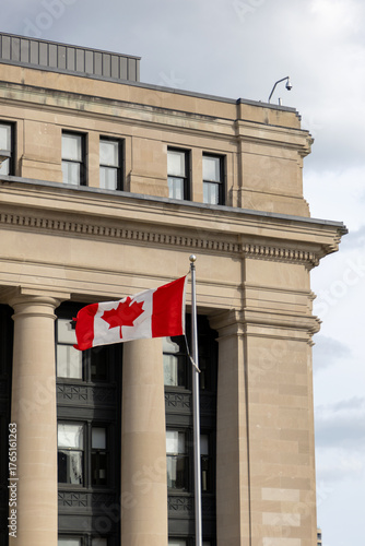 Senate of Canada building with Canadian flag.