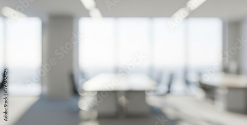Bright modern office interior with blurred conference table and large windows, sunlit glass reflections, open working area, and peaceful minimal atmosphere perfect for teamwork and creativity