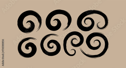 Abstract black ink swirls on a textured beige background