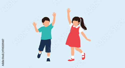 Two happy young children dancing with raised hands and smiling widely.