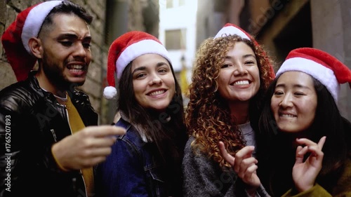 Happy diverse friends having fun celebrating holidays singing and dancing together