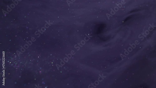 Ink blow. Fume paint. Black wave pigment spill in violet sparkling water. Color stream dye defocused cosmic abstract curl background.