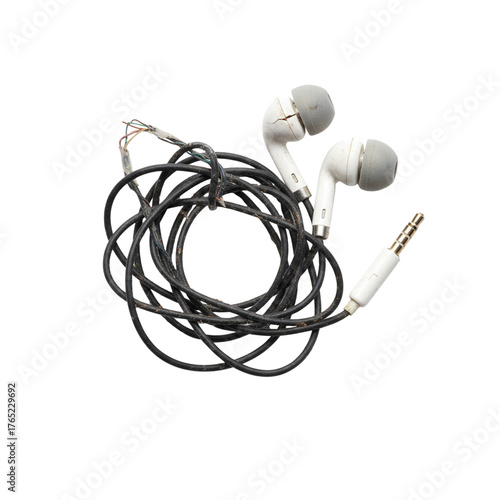 Tangled broken white wired earbuds and audio jack