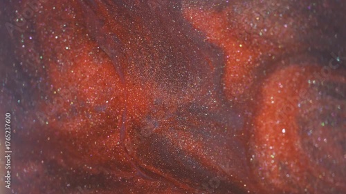 Dye fluid. Blur acrylic stream. Orange gray sparkling emulsion mix ink texture. Defocused hot color lava drip abstract background.