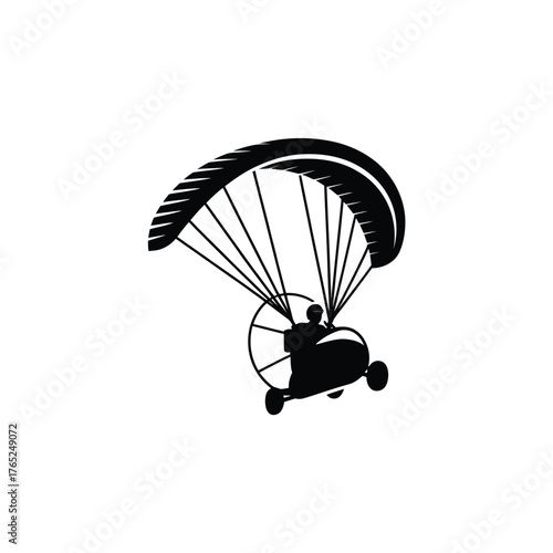 Black silhouette of a powered paraglider in flight