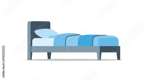 A modern single bed with a blue pillow and comforter isolated on a white background.