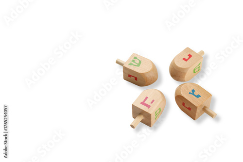 Fotografie Four colorful dreidels on a white background, isolated, PNG