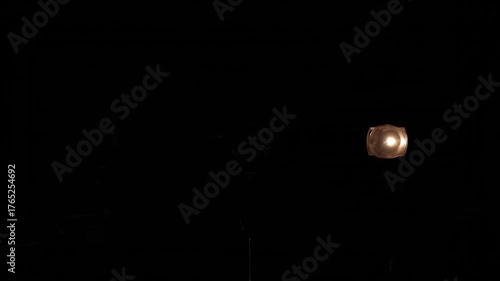 A nearly black image with a few faint light sources and indistinct shapes. Almost completely black