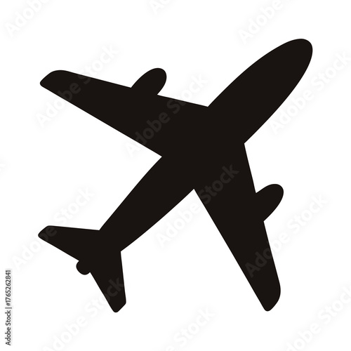 Silhouette of an airplane soaring through the sky, a symbol of travel