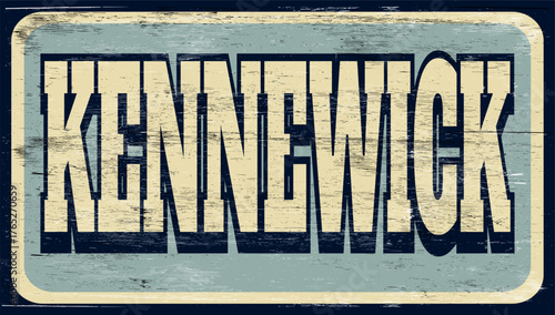 Aged retro Kennewick sign on wood