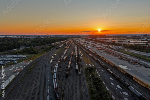 Aerial View of a Large Train Yard at Sunset
