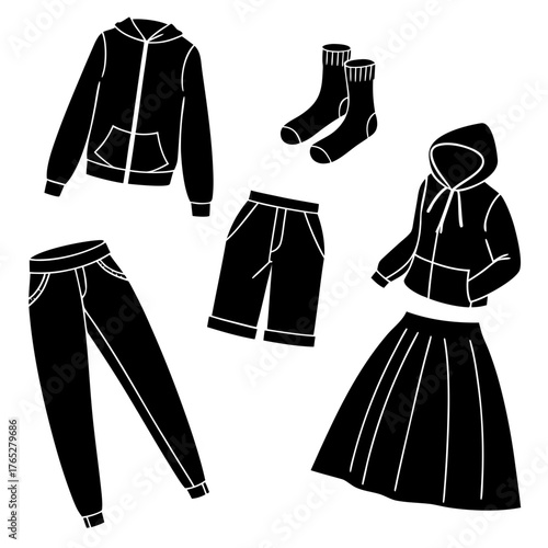 Black clothing items scattered on white background