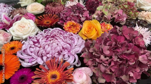 Flowers roses, chrysanthemum, lily, hydrangea, gerbera, dahlia in the bath.