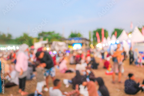 Fotografie Abstract blur people in night festival city park bokeh background
