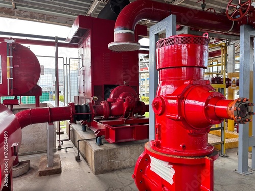 Bilde på lerret Industrial fire pump system featuring bright red centrifugal pumps, piping, and mechanical equipment in a dedicated room, emphasizing safety and automatic fire suppression technology