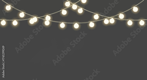 Festive hanging string lights with warm glowing bulbs on a gray backdrop.