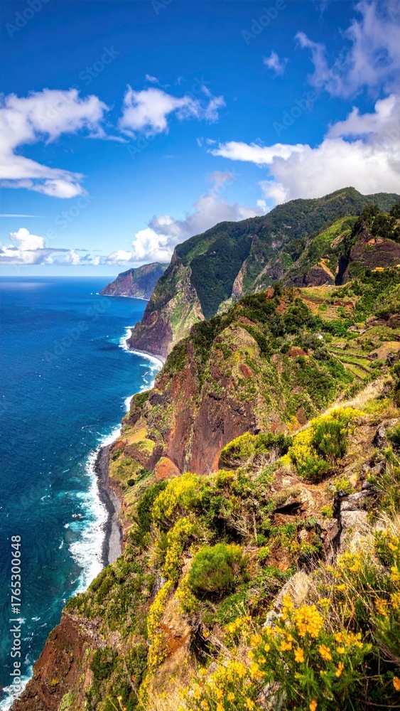 Fototapeta premium Dramatic Coastal Cliffs of Madeira Island Under a Blue Sky.