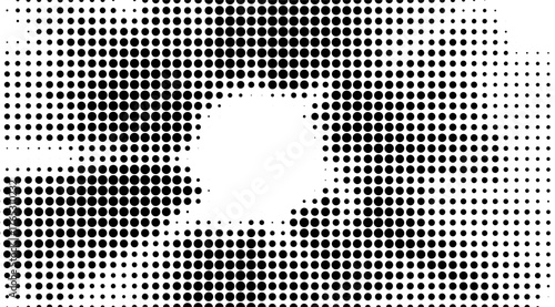 A high-contrast image showcasing a pattern of black circles with varying densities against a white backdrop, creating a visually dynamic and abstract halftone design, suitable for backgrounds