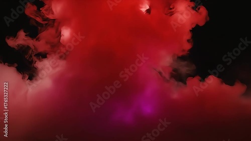 Vibrant red smoke swirling dramatically against a dark background, creating an abstract, energetic atmosphere.