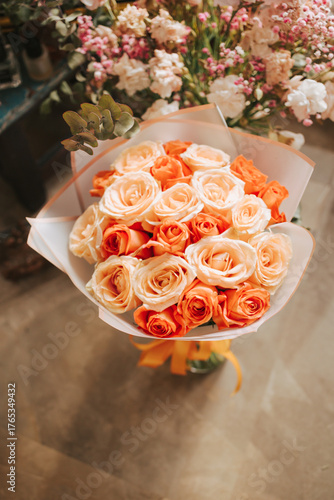 Luxurious bouquet of roses on concrete floor top view