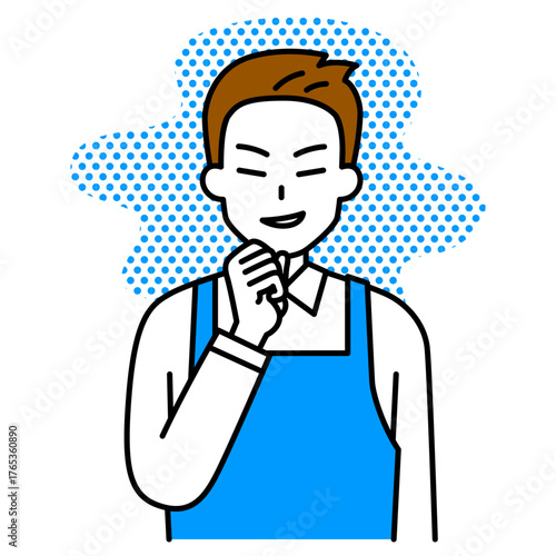 悪巧みをするエプロン姿の男性