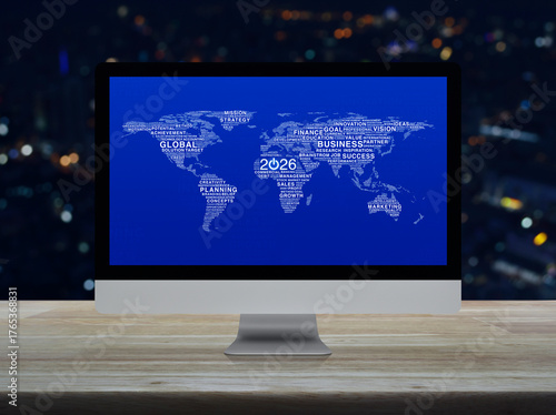 Fototapeta Naklejka Na Ścianę i Meble -  2026 start up business icon with global words world map on computer screen on table over night city, Happy new year 2026 global business start up online, Elements of this image furnished by NASA