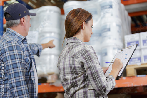 Photos staff identifying boxes in a distribution warehouse