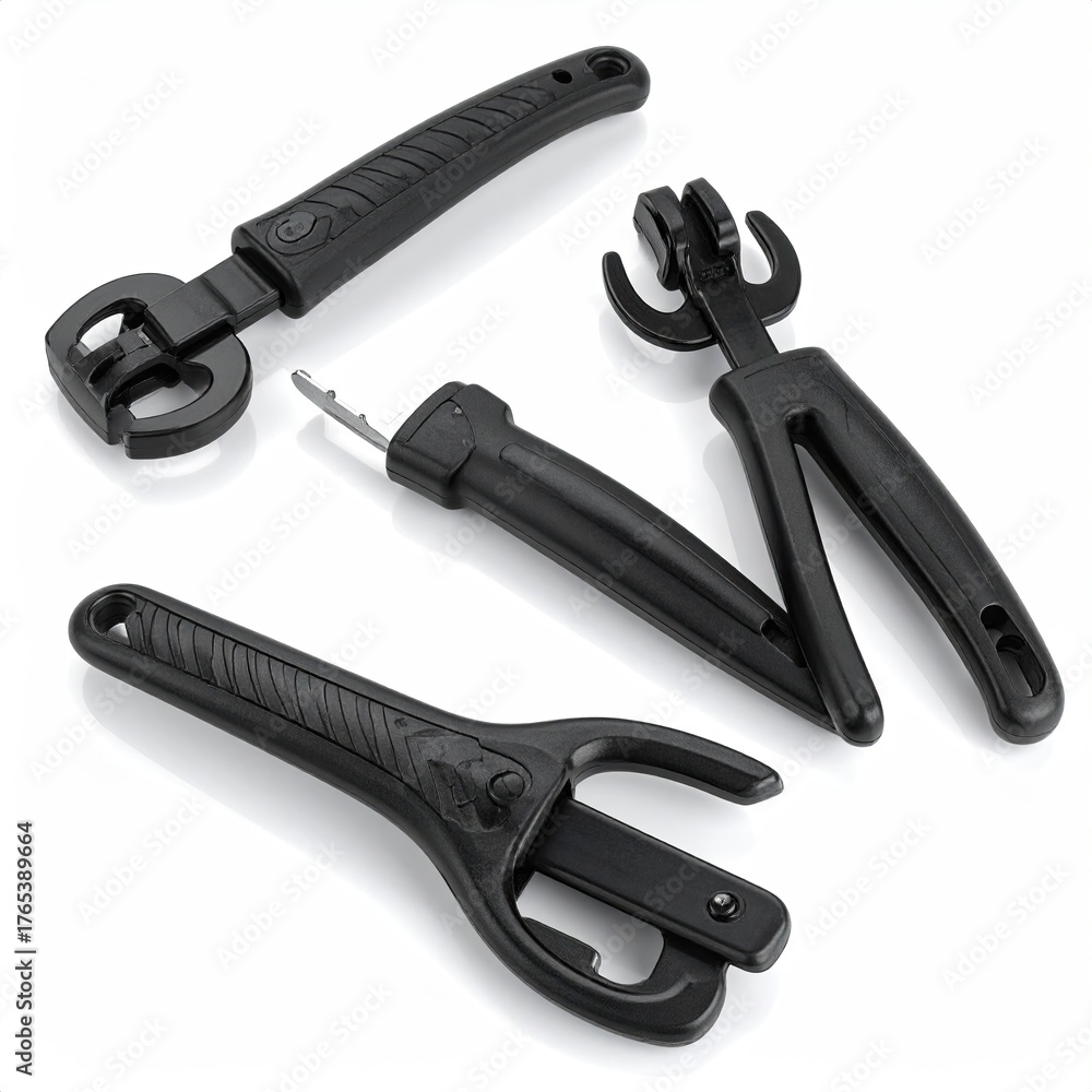 Obraz premium Black plastic tools with handles for unknown purposes