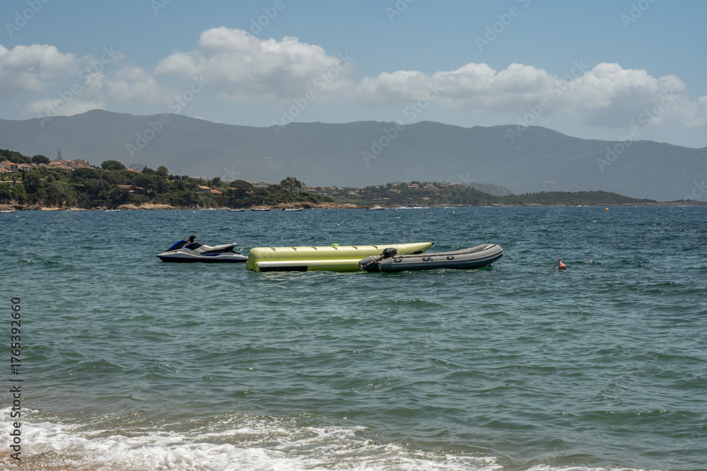 Obraz premium Spectacular view Golf at Sagone Corsica France beautyful sand Beach boats mountain village Tourism and vacations concept