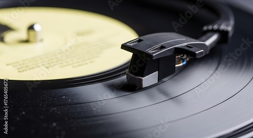 Close up of a turntable stylus on a spinning black vinyl record.