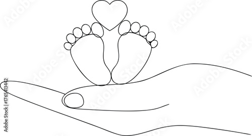 Hand holding baby feet with heart symbol love protection