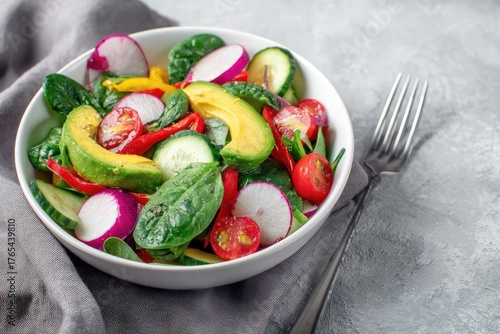 Fresh salad in a white bowl