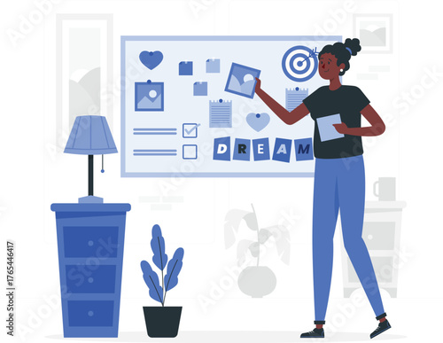 Woman arranging dream board with images and word DREAM on whiteboard vision board planning
