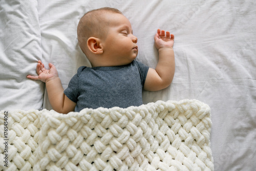 Close-up baby sleeping. three month old child boy asleep. Closeup infant napping