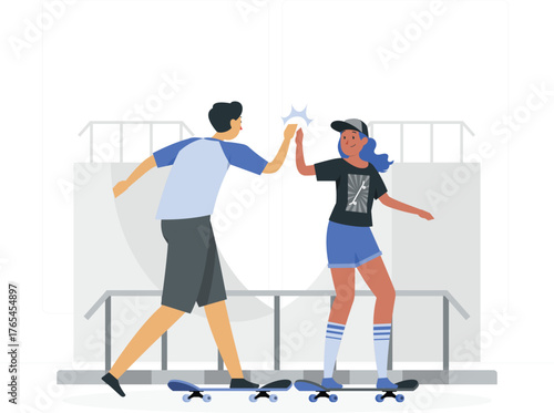 Two young people high fiving on skateboards at a skatepark skateboarding high five