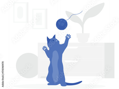 Blue cat standing on hind legs playing with a ball of blue yarn and a plant kitten feline