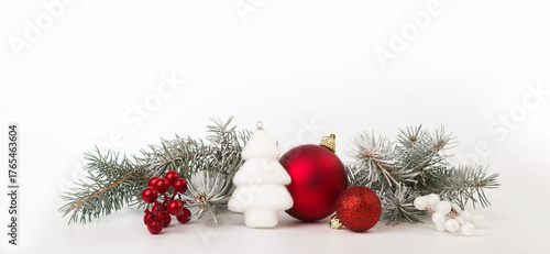 Christmas card with fir branches and Christmas decorations. Copy space