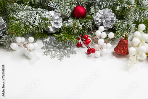 Christmas card with fir branches and Christmas decorations