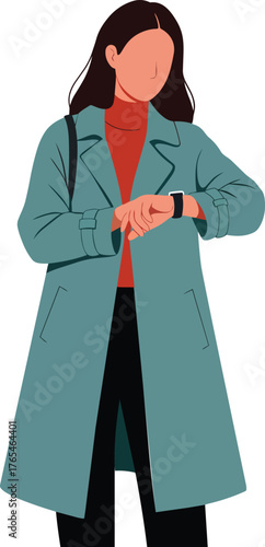Young woman checking time on modern smartwatch wearing stylish long coat
