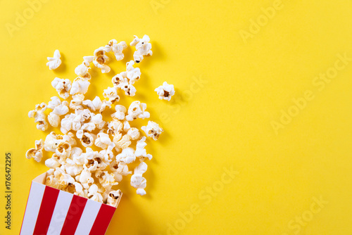 Popcorn isolated on yellow background	