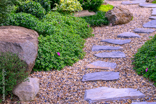 Stone stepping Walkway among lawn in a Japanese style garden.