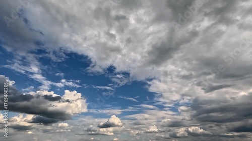 Flowing forward rainy clouds in the blue skies. 4K video (Ultra High Definition) of dramatic cloudscape. Sky and clouds Timelapse.