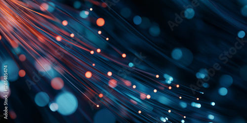 Closeup of glowing fiber optic cables with blue and red lights
